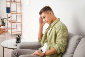 Teenaged male thinking about adolescent personality disorder treatment