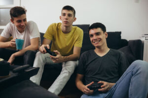 Teens thinking about social influences and peer pressure on underage drinking​